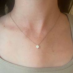 This dainty white opal Jewish star necklace has a beautiful, modern look. Available with gold or silver chain. Size: 16" Chain. 1/4" star Shop Star of David Jewelry Shop our full collection of Jewelry White Star-shaped Clavicle Chain Necklace, Dainty White Star Necklaces, Dainty White Star Necklace, Jewish Star Necklace, Passover Seder Plate, Hanukkah Decorations, Hanukkah Candles, Jewish Star, Star Necklace Gold