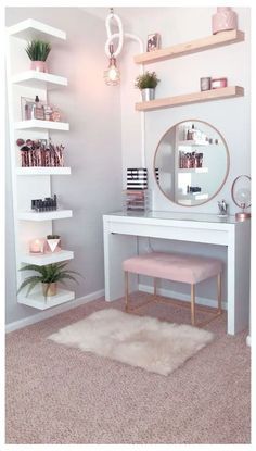 a white desk with a mirror and shelves on it in a room that has carpeted flooring