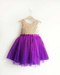 Gold and Purple flower girl's dress, gold sequined and purple tutu dress Purple Tulle Dresses With Sequins, Purple Sleeveless Tutu Dress For Pageants, Purple Sleeveless Tutu Dress For Pageant, Purple Sleeveless Tutu Dress For Party, Purple Tulle Tutu Dress For Party, Gold Sequined Princess Dress For Wedding, Purple Tulle Princess Dress For Party, Purple Princess Dress With Sequins, Purple Sequined Princess Dress