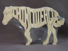 a wooden cutout of a horse with the word thunder written on it's side