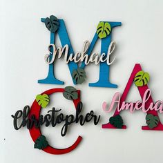 the letters are made out of wood and have leaves on them, including one for each letter