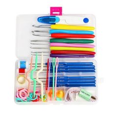 a plastic case filled with lots of different colored scissors and other crafting supplies on top of a white surface