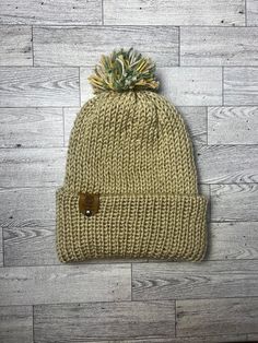 This golden brown , knitted beanie is handmade and is topped with a green pop-pom. It fits adults and older kids because of its stretchy material. Also, Bangin Beanies are machine-washable (wash cold and air dry). Each hat is uniquely made and branded with the Bangin Beanie logo . Handmade Casual Brown Beanie, Handmade Brown Casual Beanie, Warm Green Winter Bonnet, Warm Green Beanie, Brown Hand-knitted Beanie, Style Preppy, Golden Brown, Pom Beanie, Stretchy Material