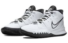 a pair of white and black nike basketball shoes