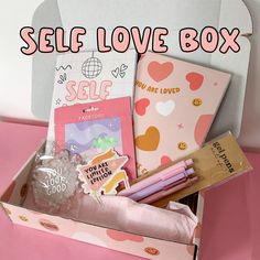 a pink box filled with lots of different items