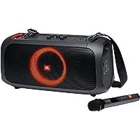 the portable speaker has an orange light on it's side and is connected to a microphone