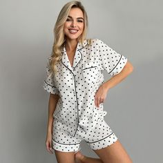 Indulge in ultimate comfort with our Women's Cotton Short Sleeve Pajama Set. Crafted from pure cotton, this pajama set features a charming heart print fabric that adds a touch of sweetness to your bedtime routine. The top comes with a convenient front pocket, perfect for storing small essentials, while the elastic waistband on the shorts ensures a comfortable fit for most body types. Whether for daily wear or lounging at home, this cozy sleepwear set is designed for everyday comfort. For care in Polka Dot Cotton Sleepwear For Pajama Party, Cozy Cotton Pajama Shorts For Pajama Party, Cozy White Pajama Party Sets, Cotton Tops With Heart Print For Loungewear, White Cotton Pajama Shorts For Home, Casual Heart Print Sleepwear For Loungewear, White Heart Print Sleepwear For Bedtime, Cozy Cotton Short Sleeve Sleepwear, Cozy Cotton Sleepwear With Short Sleeves