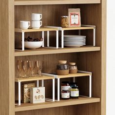 a wooden shelf filled with dishes and glasses