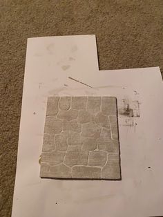 a piece of paper that is laying on the ground next to some papers with torn edges