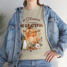 Celebrate the beauty of autumn and the spirit of gratitude with our Fall Harvest Gratitude Tee. This tee is not just a piece of clothing; it's a reminder to be thankful, be grateful, and feel blessed for all the joys in life. As the leaves turn brilliant shades of red, orange, and gold, this tee captures the essence of the season. The cozy and comfortable fabric is perfect for crisp fall days, and the elegant typography adds a touch of sophistication to your attire. Whether you're gathering around the table with loved ones or taking a leisurely stroll through a scenic fall landscape, the Fall Harvest Gratitude Tee is the perfect companion. Wear it proudly and share the message of gratitude with the world. Embrace the warmth and beauty of fall while spreading positivity with this meaningful Inspirational Crew Neck T-shirt For Fall, Inspirational Graphic Print T-shirt For Fall, Inspirational Cotton T-shirt For Fall, Elegant Typography, Appreciate Life, Orange And Gold, Be Thankful, Be Grateful, Autumn Landscape