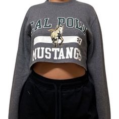 Vintage College Crop Sweatshirt Shop our vintage crop sweatshirt that vary from a range of different graphics and colors All items you see are unique and the only one available in our shop Items fit true to size All items have been cut and altered into a crop sweatshirt All items are pre-worn, recycled, well kept items that are perfect for game days, college gatherings, every day wear, and more! If you have any questions about fit or the items, please send me a message before purchase. Thank you and happy shopping Model is a size small for reference. UnderArmour Cropped Crew Neck T-shirt With Graphic Print For College, Vintage Cropped Crop Top With Graphic Print, Vintage Crop Top With Graphic Print, Retro Crew Neck Crop Top With Graphic Print, Retro Crew Neck Crop Top For Streetwear, Crew Neck Cropped Shirt With Graphic Print For Streetwear, Crew Neck Cropped Shirt With Text Print For Streetwear, Vintage Cropped T-shirt With Letter Print For Streetwear, Graphic Print Crew Neck Cropped Shirt For Streetwear