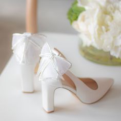 So many of you have been asking for pretty wedding shoes with block heels... Meet Valentina! Made with the finest ivory satin, Valentina is perfect for modern brides! Made with the finest ivory satin with pretty bow with jewel details! These wedding shoes are perfect for outdoor and garden weddings where you won't be worried about heels getting stuck!!! Bridal Shoes Block High Heel with removable ankle strap Style “Valentina” in ivory 3.5" heel Bridal Shoes with bow and jewel details Adjustable Gold Bridesmaid Shoes, Silver Bridesmaid Shoes, Comfortable Wedding Heels, Wedding Shoes Block Heel, Embellished Wedding Shoes, Mother Of The Bride Shoes, Bridesmaids Shoes, Gold Wedding Shoes, Ivory Bridal Shoes