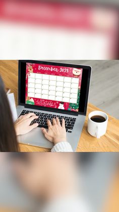 a woman is typing on her laptop at a table with a cup of coffee in front of her