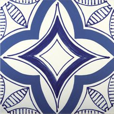 a blue and white tile design with leaves on the bottom corner, in an ornate pattern