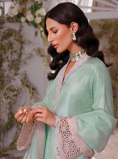 Mint Colored Pakistani Eid Dress in Salwar Kameez Style is an epitome of elegance and royalty. Lavish designs, lacework, and cutwork embroideries make this stunning Pakistani Kameez Trouser an epitome of beauty and your foremost priority for the festive occasion. Kameez: Perfectly stitched kameez in the mint shade is a lavish attire to wear on the big day. The fabric of the kameez is raw silk. Fine work of cutwork embroideries and lacework on the sleeves and borders give a perfect finishing to t Salwar Kameez Style, Pakistani Kameez, Kameez Style, Tailor Design, Zainab Chottani, Eid Dress, Pretty Embroidery, Latest Dress Design, Pakistani Fashion Casual