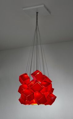 a red chandelier hanging from a ceiling