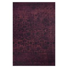 an area rug with dark purple and black colors