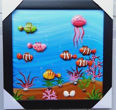 an underwater scene with clown fish and other sea creatures painted on the side of a wall