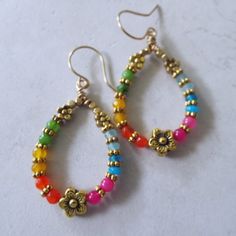 Multi Colored Jade Flower Dangle Hoop Earrings on Brass Wires 2.25" Long. These are super colorful and pretty. Rainbow Bohemian Jewelry For Spring, Bohemian Rainbow Jewelry For Spring, Spring Rainbow Bohemian Jewelry, Bohemian Gold Hoop Earrings For Spring, Bohemian Dangle Hoop Earrings For Spring, Multicolor Small Hoop Jewelry For Spring, Multicolor Bohemian Hoop Earrings For Spring, Handmade Multicolor Flower Earrings For Spring, Handmade Multicolor Hoop Earrings For Spring