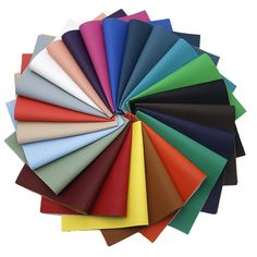 many colors of leather are arranged in a circle on top of each other, with one color