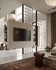 a large flat screen tv mounted to the side of a wall in a living room