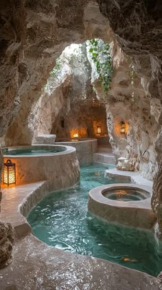 an indoor hot tub in the middle of a cave