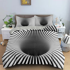 a bed with black and white designs on it