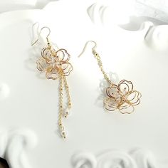 👂PRODUCT DETAILS Asymmetric Wire Floral Earrings by ELEVEN11DREAM - Material: High Quality Crystal & 14k gold plated + Swarovski Pearl - Size: Length 3.93in. & 2.75in. /Drop Length 3.34 in. & 2.16in. /width1.18 in.     Length 9cm & 7cm /Drop Length 7.5cm & 5.5cm/width3cm - Sold in pairs 🎈SHIPPING - All orders will be shipped within 1-3 business days after the order has been received - Ship all orders via USPS First-Class Mail - FREE SHIPPING for all USA domestic orders 💖PLEASE READ THE PRODUCT DESCRIPTION - All products are made by my hand with love and care in my studio - All products are nicely packaged in a protected clear box or bag to avoid damage - Keep your jewelry away from water or any liquid chemicals to avoid discoloration (for example, swimming or bathing) - Safely store you Elegant 3d Flower Earrings For Jewelry Making, Dangle Earrings With 3d Flowers, Feminine Flower Charm Drop Earrings, Delicate Dangle Earrings With 3d Flowers, Gold Dangle Earrings With Flower Decoration, Delicate 3d Flower Drop Earrings, Delicate 3d Flower Dangle Earrings, Metal Drop Earrings With Flower Charm, Metal Flower Charm Drop Earrings