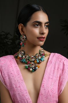 Multicoloured Navrattan Kundan Inspired Necklace with Earrings. This beautifully handcrafted necklace is set in silver and copper alloy and plated with 22k gold. This necklace with a twist of Pearl stones by Paisley Pop is a perfect accessory for an Indian Bride. LENGTH Necklace Size - Length 16 inches Closure - Adjustable Thread Dori DETAILS -100% top Quality Faux Glass Polki -22K gold and silver Plated silver copper alloy. -Handcrafted in our all girls workshop in Paisley Pop Studio, Jammu and Multicolor Tilla Earrings For Rituals, Multicolor Temple Jewelry Pendant Set, Traditional Multicolor Jewelry Sets With Oxidized Finish, Traditional Multicolor Oxidized Jewelry Sets, Traditional Multicolor Jewelry For Rituals, Multicolor Oxidized Jewelry As Gift, Traditional Multicolor Oxidized Finish Jewelry Sets, Multicolor Kundan Necklace For Rituals And Festive Occasions, Multicolor Necklace With Oxidized Finish For Gift