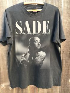 Sade Vintage 90s Graphic Shirt, Sade Retro Vintage, Retro Sade Shirt, Sade Oversized Shirt, Vintage Diamond, Gift For Her, Sade Tour Shirt NOTE ABOUT SHIPPING & CUSTOMS I use local printers in United States, Canada, UK, Australia. Germany & Italy. This ensures that you will never be charged with surprise customs fees on your tee. . All t-shirts are custom made to order and are printed using the latest ink to garment technology, a technology superior to heat transfer or screen print. - Heather co Sade 90s, Sade Adu, Retro Sweatshirts, Crew Neck Tshirt, Diamond Gift, Tour Shirt, Tour T Shirts, Graphic Shirt, Vintage Diamond