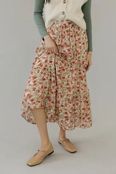 Float through your day in the Haven Skirt, with its midi length and flowy tiered design adorned with charming ruffle details. The playful floral pattern adds a touch of whimsy to any outfit. Perfect for those who don't take themselves too seriously!