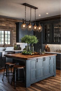 Rustic kitchen island featuring wrought iron accents Barndo Designs, Farmhouse Kitchen Aesthetic, Milford Pa, Diy Island, Navy Blue Kitchen Cabinets, Lake Kitchen, Cabin Remodel, Butcher Block Island Kitchen, Butcher Block Island