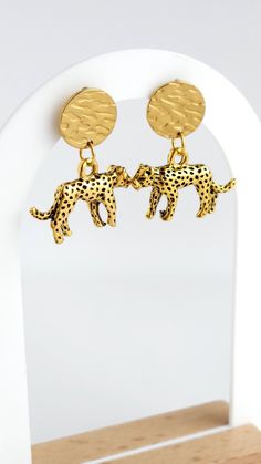 New Minimalist 14k Gold Plated Leopard Cheetah Jungle Charm Stud Disk Earrings Handmade Jewellery Add a touch of wild elegance with these minimalist earrings featuring a charming leopard cheetah pendant. Handmade with care. These earrings showcase a jungle-inspired charm hanging from a 14k gold-plated stud base with a unique hammered disk pattern, offering an exotic and stylish accessory. Nickel-free and lead-free, these earrings are perfect for sensitive skin. They make a delightful gift for bi Panther Earrings, Leopard Earrings, Disc Earrings, Earrings Hoop, Cubic Zirconia Earrings, Nature Inspired Jewelry, Zirconia Earrings, Huggie Earrings, Minimalist Earrings