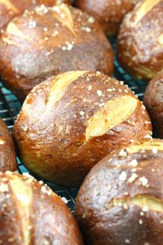 freshly baked muffins cooling on a rack with sesame seed sprinkles