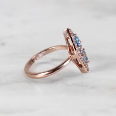 Our Valentina ring incorporates round, baguette and trillion stones to create a unique vintage-inspired look. A gorgeous ring that can be worn on any finger.Valentina:All natural stones.Low-set, not a high sitting ring.Elongated Hexagon overa...