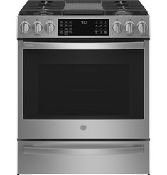 a stainless steel oven with the door open and its electronic controls on it's side