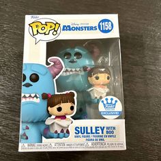 two funky little monsters are in the packaging for this pop vinyl figure set, which includes sulley and dobby