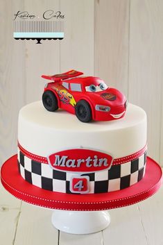 a birthday cake with a car on top