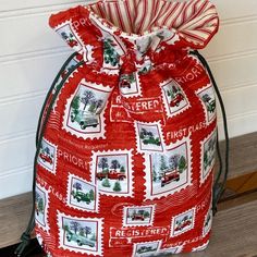 a red drawsack bag with stamps on it