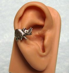 "This dinosaur ear cuff have a prehistoric feel, beautifully detailed and patina design and is set on a adjustable ear cuff for your comfort needs. Dinosaur ear cuff is approximately 10mm long x 22mm wide ( 7/16\" x 11/16\" ). Other ear cuffs https://www.etsy.com/shop/ranaway?section_id=12267071 This listing is for one dinosaur ear cuff. Unisex item, make the perfect gift for yourself or someone special. For more items, visit my store: Ranaway.etsy.com. Thank you!" Adjustable Metal Nickel-free Ear Cuff, Adjustable Nickel-free Metal Ear Cuff, Adjustable Brass Pierced Ear Cuff, Adjustable Silver Brass Cartilage Earrings, Steampunk Bee, Silly Earrings, Patina Design, Animal Ears, Ear Cuffs