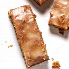 three pieces of brownie sitting on top of a white surface