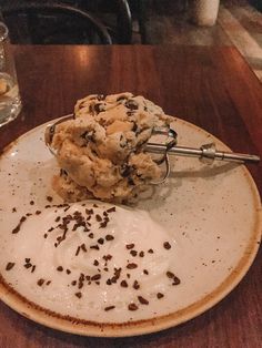 an ice cream sundae on a white plate