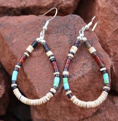 "Heishi and shell pueblo earrings. Tribal colors. Simple and earthy. Everyday hippie earrings. - 2 1/2\" X 1\" -silver tone metal earring hooks - comes in nice presentation box Check out the rest of our collection: https://www.etsy.com/shop/NewMexicoGems Thank you for your business. We appreciate you." Brown Southwestern Teardrop Jewelry, Southwestern Style Teardrop Brown Jewelry, Southwestern Brown Teardrop Jewelry, Southwestern Style Brown Teardrop Jewelry, Brown Teardrop Earrings For The Beach, Brown Teardrop Earrings For Beach, Native Earrings, Beaded Jewelry Bracelets, Wire Wrapped Jewelry Diy