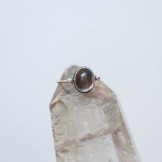 Sometimes you want to gaze down at your ring and see perfect balance and grace. That's what this Dainty Smoky Quartz Delica Ring has to offer. High-grade smoky quartz stone with a simple, sterling silver design. Perfect little ring. Lovely, traditional, dainty ring of 10X12 mm Smoky quartz cabochon set in .925 sterling silver oxidized and burnished bezel and wire. Simple, elegant and perfect. This lovely, translucent, and sparkling warm, taupe grey-colored ring is created using traditional silve Nickel Free Spiritual Toe Rings, Spiritual Nickel-free Toe Rings, Spiritual Healing Rings, Nickel Free Oval Spiritual Jewelry, Sterling Silver Spiritual Toe Ring, Nickel-free Oval Spiritual Jewelry, Healing Gemstone Rings In Fine Jewelry Style, Spiritual Nickel-free Open Ring Jewelry, Spiritual Sterling Silver Opal Ring For Healing