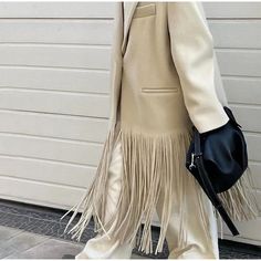 Fall Outerwear With Tassels For Work, Fall Workwear Outerwear With Tassels, Winter Fringe Outerwear, Chic Fringe Outerwear For Work, Chic Winter Fringe Outerwear, Elegant Winter Outerwear With Tassels, Chic Fall Outerwear With Tassels, Trendy Winter Outerwear With Fringe, Beige Tasseled Outerwear For Spring