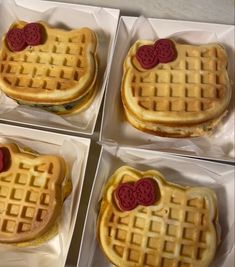 four waffles with red hearts on them