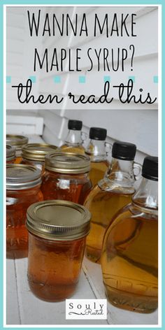 several jars filled with liquid sitting on top of a white wooden table next to each other