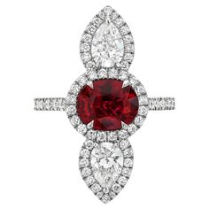 For Sale on 1stDibs - Superb natural Ruby ring featuring a 2.09 carat unheated Ruby oval, and a pair of GIA certified 1.01 carat pear shaped diamonds, D/VVS2-VS1, set vertically Star Ruby Ring, Natural Ruby Ring, Contemporary Engagement Rings, Platinum Earrings, Spinel Ring, Platinum Diamond Rings, Modern Engagement Rings, Diamond Cocktail Rings, Antique Diamond