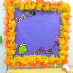 a purple and orange bulletin board with the words math monster written in front of it