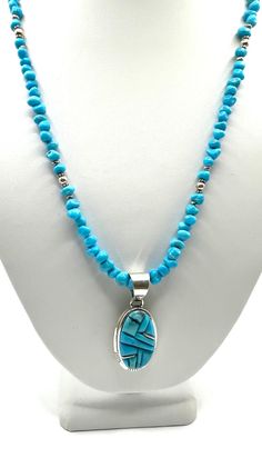 Indulge in the artistry of authentic Navajo craftsmanship with this stunning Kingman Turquoise bead and inlay pendant. Featuring beautiful Kingman Turquoise beads and an exquisite inlay design this pemdant is a true testament to the skill and talent of Navajo artisans. Add a touch of elegance and culture to your jewelry collection with this exquisite piece  Authentic Navajo craftsmanship beautiful kingman turquoise beads and inlay pendant great quality and price. 18" with extension on bead necklace Traditional Blue Turquoise Necklace With Inlay, Artisan Blue Turquoise Necklace With Inlay, Artisan Turquoise Necklace With Inlay, Spiritual Turquoise Necklace With Inlay, Southwestern Style Blue Inlay Necklace, Southwestern Blue Necklace With Inlay, Turquoise Spiritual Necklace With Inlay, Luxury Turquoise Inlay Necklace, Spiritual Turquoise Inlay Necklace